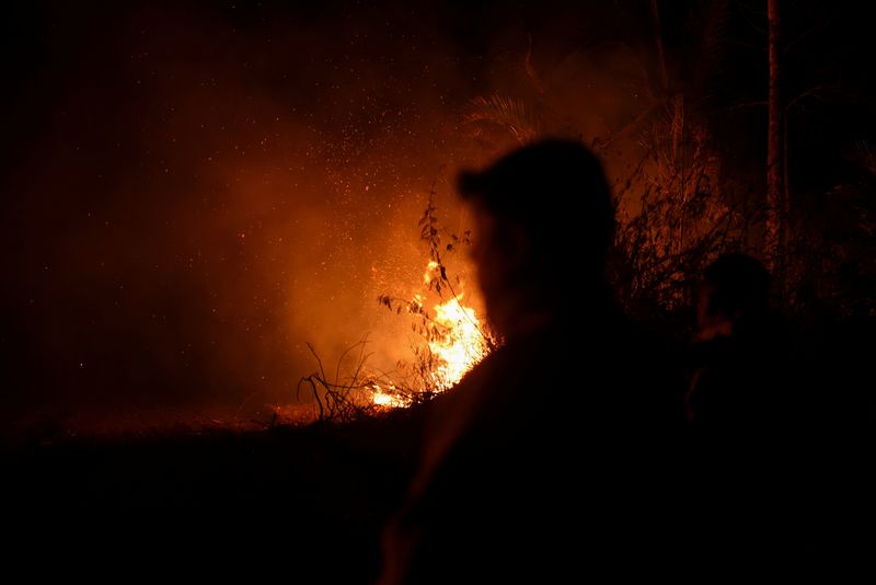 As Bolivia wildfires rage, smoke turns day into night