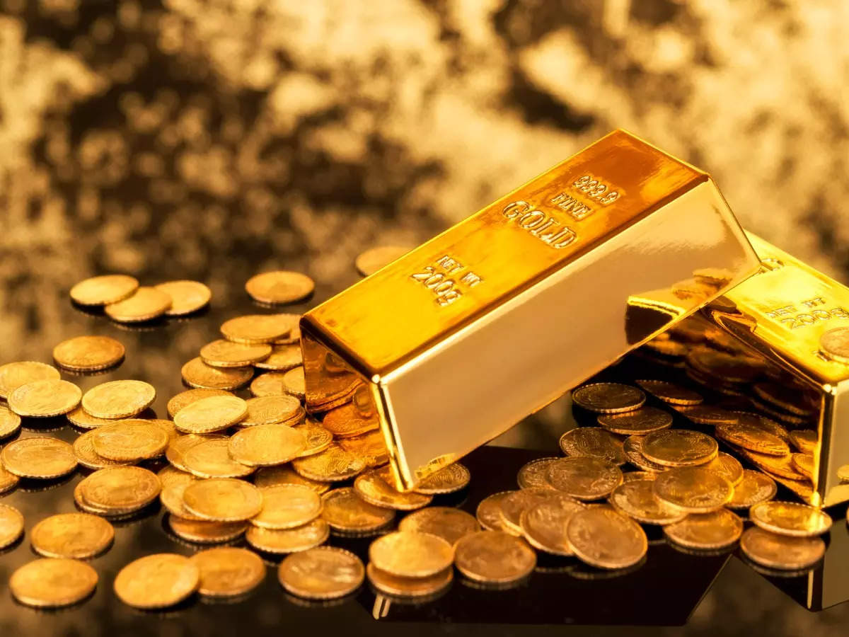 Gold eases as dollar firms, investors seek more cues on Fed's rate path