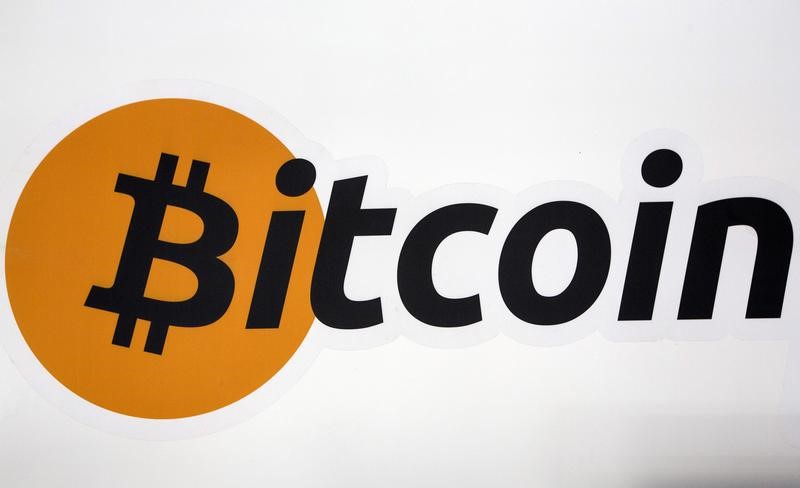 Cryptocurrency-Related Stocks Fall as Bitcoin Drops to $66,000