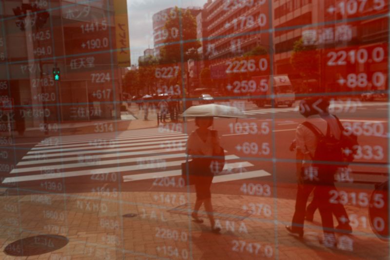 Asian stocks slide amid Trump tariff worries, yen gains