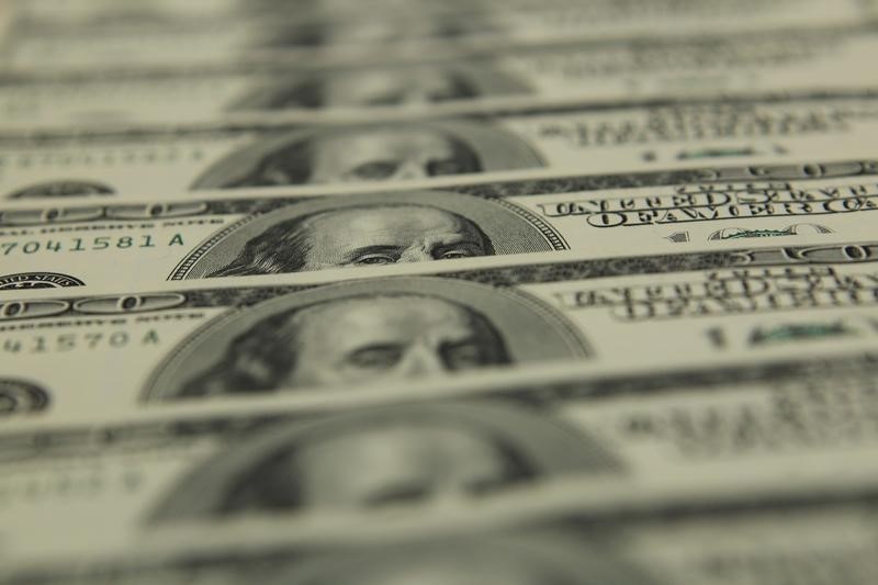 Dollar hands back some gains; Jackson Hole looms large