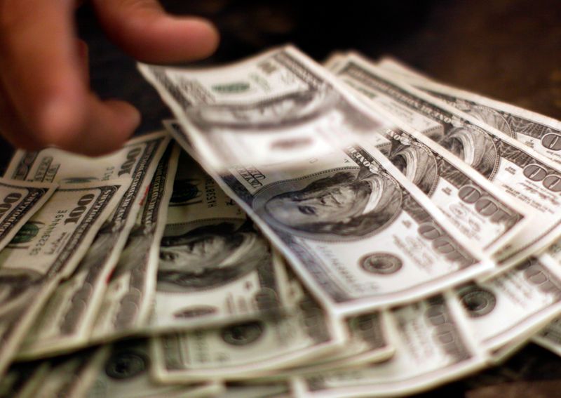 Dollar inches higher, but remains close to seven-month lows