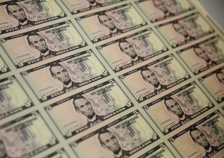 Dollar stabilizes after sharp rebound; Fed officials in focus