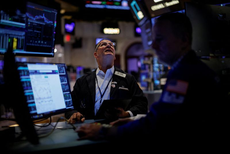 Dow registers record high close as US jobs data eases economic worries