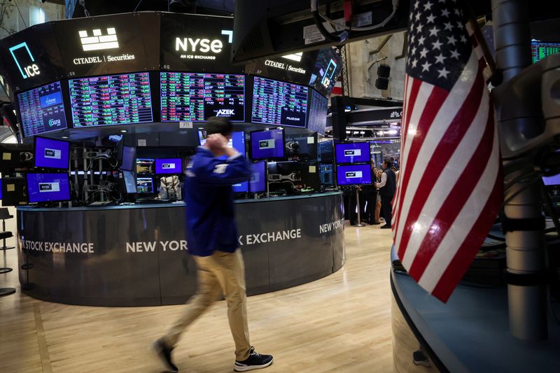 Dow and S&P end at fresh record highs, lifted by Netflix earnings and tech stocks