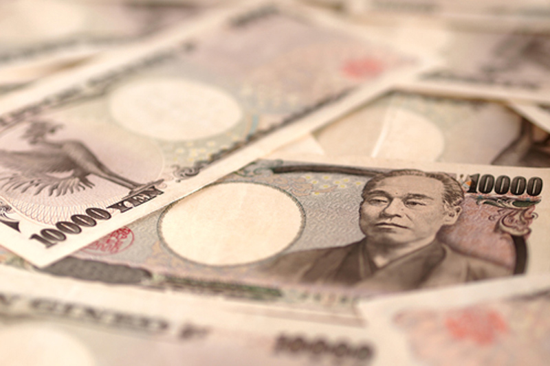 Bank of Japan maintains interest rate, yen weakens