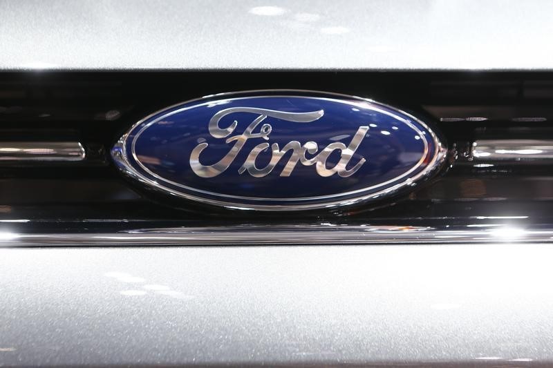 Ford Motor cuts profitability guidance, Q3 results beat; shares slide