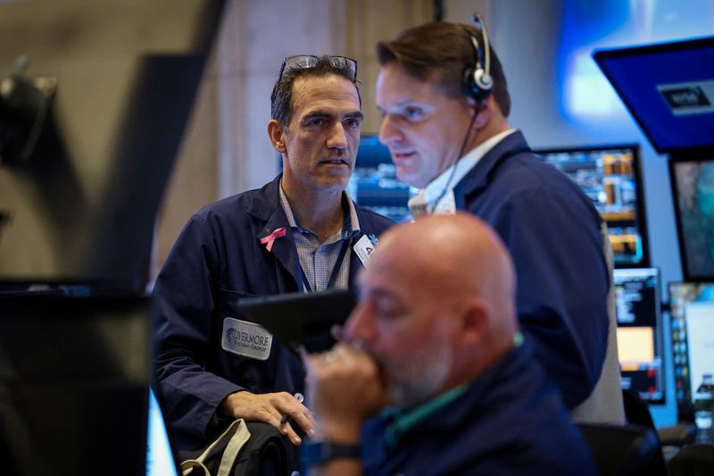 Wall Street opens lower ahead of data-packed week