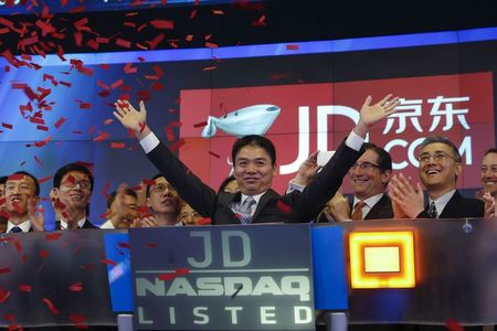 JD.com rises on new buyback plan