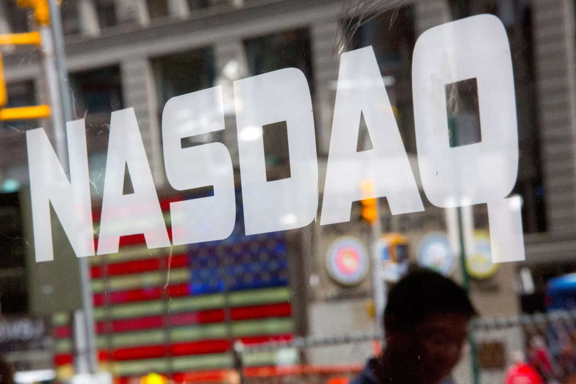 Nasdaq closes above 17,000; S&P 500 slightly higher, Dow down