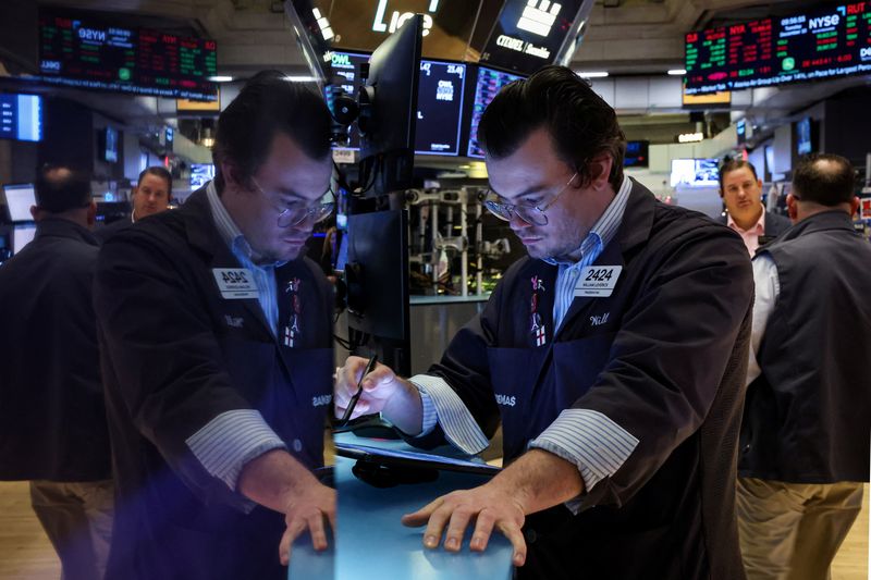 Wall Street slips as bond yields climb; Broadcom surges
