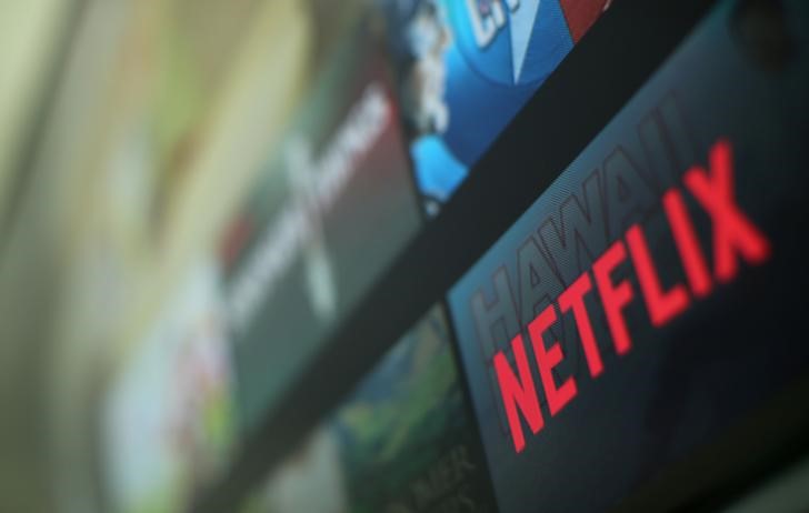 Netflix shares retreat after hitting record high