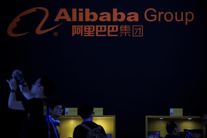 Tesla, Alibaba lead morning market cap stock movers on Friday